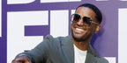 Actor Larenz Tate was seen wearing gold Gucci GG0062S 003 aviator sunglasses with green and red webbing details at the American Black Film Festival 2025 in Miami. Shop online now on Pretavoir