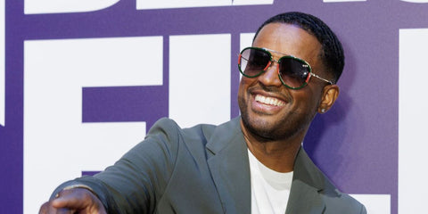 Actor Larenz Tate was seen wearing gold Gucci GG0062S 003 aviator sunglasses with green and red webbing details at the American Black Film Festival 2025 in Miami. Shop online now on Pretavoir