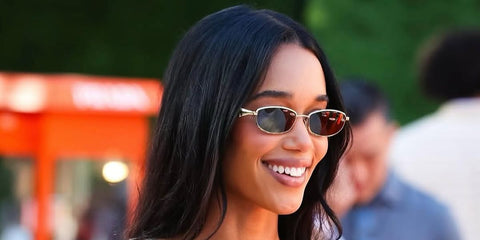 Laura Harrier was seen wearing Prada PR D51S 5AK20I sunglasses at the Prada Eyewear Pop Up Opening in May 2026.