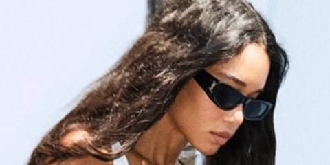 Laura Harrier wears Saint Laurent SL M140 001 sunglasses in Instagram post.