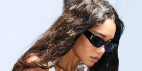 Laura Harrier wears Saint Laurent SL M140/F 001 sunglasses in Instagram post.