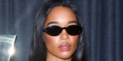 Laura Harrier wears Saint Laurent Sun SL 567 001 sunglasses at Saint Laurent's Womenswear Spring-Summer 25 show at Paris Fashion Week 2025.