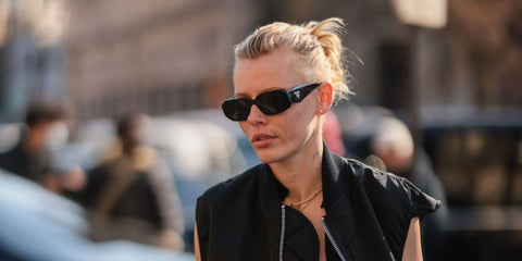 Model Lauren Wasser was seen weariing black Prada PR 17WS 1AB5S0 Symbole Sunglasses at the Sacai Fall/Winter 2022 fashion show during Paris Fashion Week.