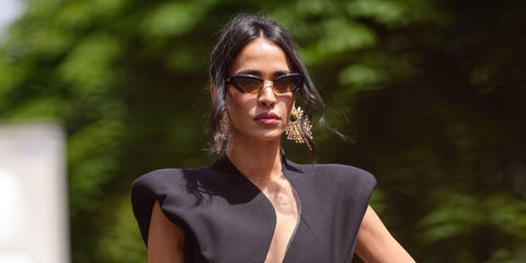 Tunisian television presenter Leila Ben Khalifa was seen wearing black Bottega Veneta BV1387S 001 cat eye sunglasses with yellow lenses during Paris Haute Couture Week season Fall/Winter 2025.