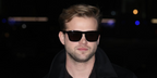 Leo Woodall was seen wearing black Burberry BE4434 4121/87 sunglasses at the Burberry Fall/Winter 2026 fashion show during London Fashion Week.