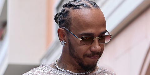 Lewis Hamilton was seen wearing gold Ray Ban x ASAP Rocky Metal RB 3928 001/8H rimless rectangular sunglasses with violet gradient lenses at the F1 Grand Prix of Monaco 2026.