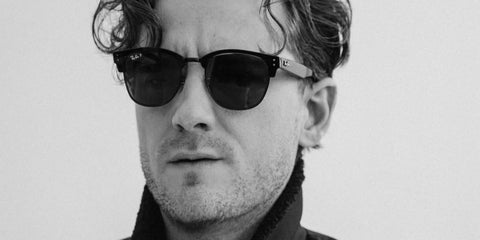 Lewis Pullman was seen wearing Ray-Ban Clubmaster Reverse RB R0504S 6783/9A Polarised half-rim sunglasses in a Numero Netherlands feature, April 2025
