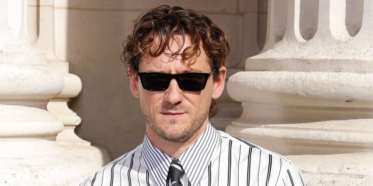 Lewis Pullman was seen wearing black Saint Laurent Sun SL 890 Betty Thin 001 sunglasses at the Saint Laurent Menswear Spring/Summer 2027 fashion show during Paris Men's Fashion Week.