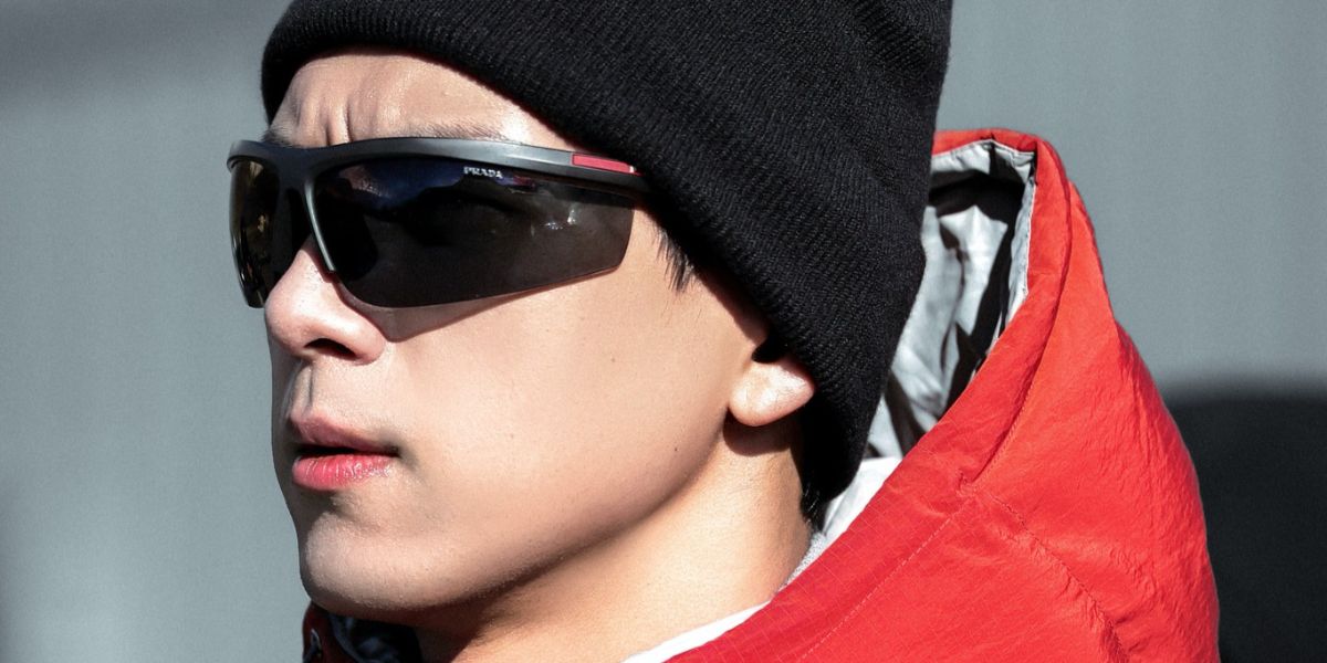Chinese actor Li Xian was seen wearing black Prada Linea Rossa SPS A02 1BO5S0 wraparound sunglasses in New Zealand, October 2025. Shop online now on Pretavoir
