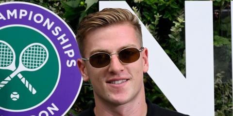 Footballer Liam Delap was seen wearing gold Prada PR B53S 5AK09Z sunglasses with brown lenses at the Wimbledon Tennis Championships 2026.