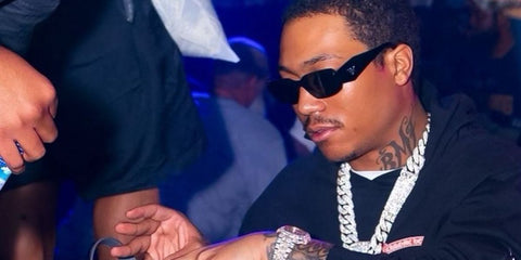 Demetrius "Lil Meech" Flenory Jr. is seen wearing Prada PR 17WS 1AB5S0 Symbole Sunglasses while partying