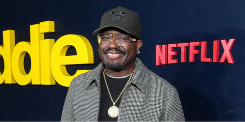Comedian and actor Lil Rel Howery was seen wearing gold Versace 1308 1002 square optical glasses at the premiere of Netflix's "Being Eddie" in Los Angeles, November 2025.