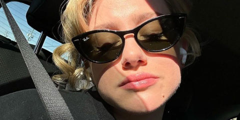 Lili Reinhart is seen wearing Ray-Ban Nina RB 4314N 601/31 cat eye sunglasses in her social media post