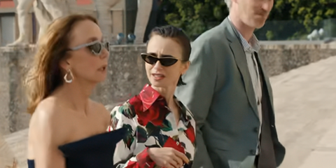 Lily Collins was seen wearing black and gold Loewe Signature LW40166I 01A sunglasses in Emily in Paris season 5, episode 2 as Emily Cooper.