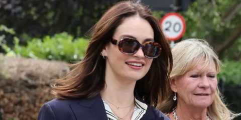 Lily James was seen wearing tortoiseshell Loewe Chunky Anagram LW40103U 52E round sunglasses to attend the 2023 Wimbledon Tennis Championship