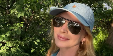 Lindsay Lohan was seen wearing gold and tortoise Saint Laurent Sun SL 864 003 aviator sunglasses in her Instagram post, July 2026.