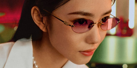 Chinese actress Liu Haocun was seen wearing gold Miu Miu MU A54S ZVN70O rimless oval sunglasses with red gradient lenses in the Miu Miu Lunar New Year 2025 campaign.