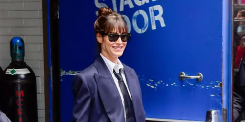 Lizzy Caplan was seen wearing the iconic black Ray-Ban Wayfarer 2140 901 sunglasses outside of "Good Morning America" studio in New York City