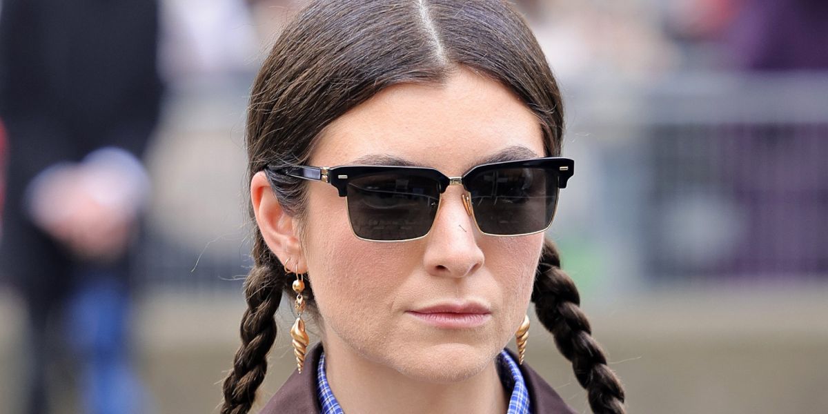 Lorde was seen wearing black Miu Miu MU 10ZS 1AB5S0 half-rim sunglasses to attend the Miu Miu Fall/Winter 2025 fashion show during Paris Fashion Week