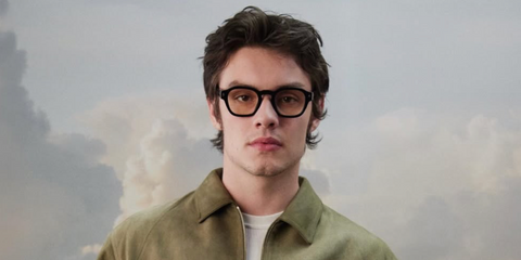 Actor Louis Partridge was seen wearing black Prada PR A16S 16K60K sunglasses with clear Blue Control lenses at the Prada Mode event in New York City, June 2026.
