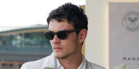 Louis Partridge was seen wearing black Prada PR C09S 16K08G Polarised sunglasses at the Wimbledon Tennis Championship 2026 Final