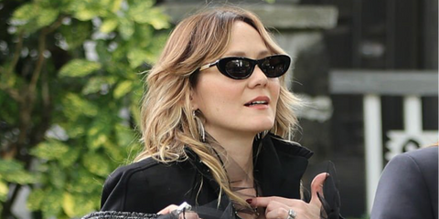 Actress Louisa Krause was seen wearing black Bottega Veneta BV1447S 001 cat-eye sunglasses on the set of new Apple TV series in New York City, August 2026.