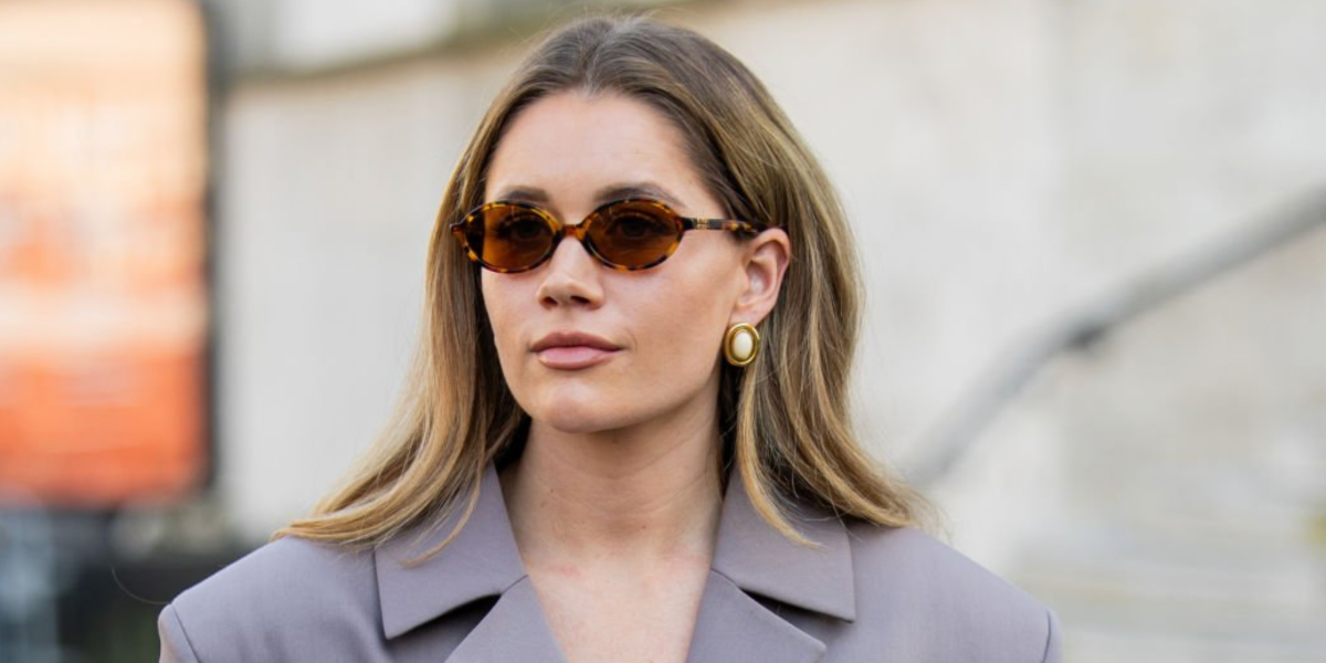 Swedish fashion influencer Lovisa Barkman was seen wearing tortoiseshell Miu Miu MU 04ZS 19P2Z1 oval sunglasses with brown lenses during Paris Fashion Week season Fall/Winter 2025. Shop online now on Pretavoir