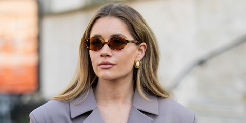 Swedish fashion influencer Lovisa Barkman was seen wearing tortoiseshell Miu Miu MU 04ZS 19P2Z1 oval sunglasses with brown lenses during Paris Fashion Week season Fall/Winter 2025. Shop online now on Pretavoir