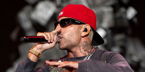 Italian rapper Luche was seen wearing black Balenciaga BB0157S 001 wraparound sunglasses onstage during Rock In Roma, July 2025.