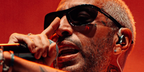 Italian rapper Luche was seen wearing black Bottega Veneta BV1348S 001 sunglasses at his concert in Puglia, August 2025.