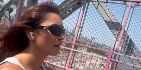 New Zealand actress Luciane Buchanan was seen wearing black Miu Miu MU 14ZS 16K08Z sunglasses while she was cycling in New York City, shared through her Instagram post in June 2025.