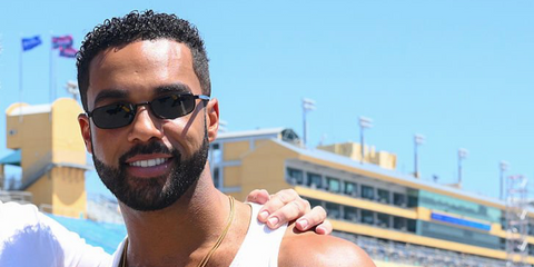 Lucien Laviscount was seen wearing black Prada PR B54S 1AB5Z1 Polarised sunglasses at the Miami E-Prix, April 2025.