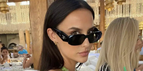 Lucy Watson was seen wearing black Prada PR 17WS 1AB5S0 Symbole Sunglasses