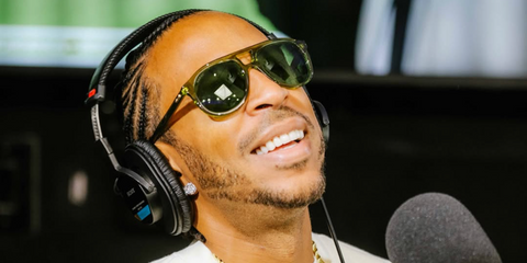 Ludacris was seen wearing transparent green Gucci GG1320S 003 aviator sunglasses with green lenses in an interview with Power 106 FM, June 2026.