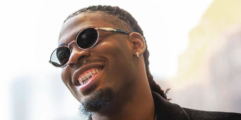 Canadian professional basketball player Luguentz Dort was seen wearing black and gold Prada PR 65ZS ZVN09T oval sunglasses. Shop online now on Pretavoir