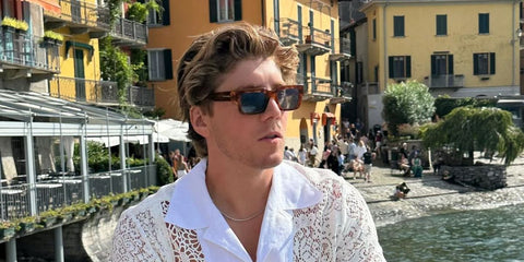 Lukas Gage was seen wearing tortoiseshell Giorgio Armani AR8184U 5988/02 sunglasses with blue lenses in his Instagram post, August 2023