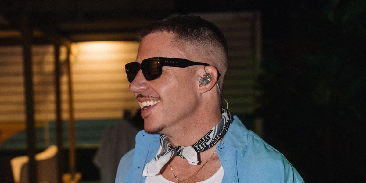 Macklemore was seen wearing black Gucci GG1218S 001 square sunglasses at his concert in Malaga, Spain, June 2024