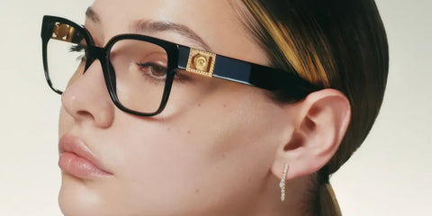 Madelyn Cline was seen wearing black Versace 3329B GB1 square optical glasses in the Versace Eyewear Spring/Summer 2023 campaign.