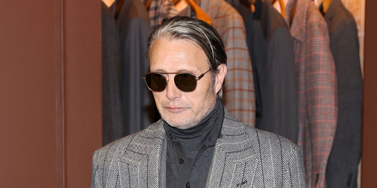Actor and brand ambassador Mads Mikkelsen was seen wearing matte brown Zegna EZ0290 49E sunglasses at the Zegna Fall/Winter 2026 fashion show during Milan Men's Fashion Week.