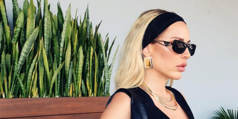 Celebrity stylist Maeve Reilly was seen wearing black Prada PR 14YS 1AB5S0 sunglasses in her Instagram post