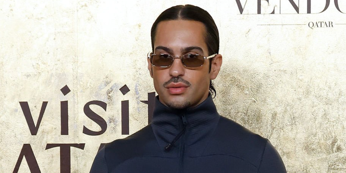 Italian singer Mahmood was seen wearing silver Prada PR B54S 1BC30P rectangular sunglasses with light brown lenses at the Fashion Trust Arabia 2025 in Qatar, Doha.