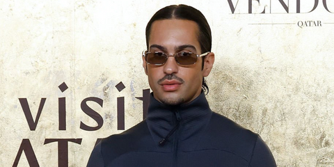 Italian singer Mahmood was seen wearing silver Prada PR B54S 1BC30P rectangular sunglasses with light brown lenses at the Fashion Trust Arabia 2025 in Qatar, Doha.