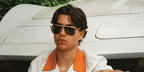 Actor Malachi Barton was seen wearing gold Tom Ford Stavros TF1204 30N sunglasses with grey lenses in a Flaunt Magazine feature, August 2026.