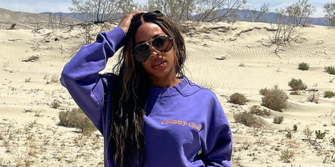 Malika Haqq was seen wearing gold Porsche Design 8613 B Interchangeable Lenses Polarised aviator sunglasses in her Instagram post