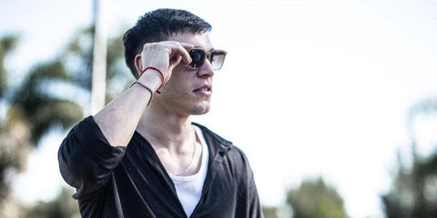 Uruguayan footballer Manuel Ugarte was seen wearing beige Ray-Ban RB 4362 6166/13 sunglasses in Manchester United's social media post, March 2025.