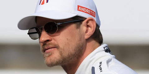 Swedish racing driver Marcus Ericsson was seen wearing Prada PR B53S ZVN02C oval sunglasses with grey gradient lenses during the INDYCAR Open Testing in Indianapolis, April 2025.