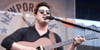 Marcus Mumford was seen wearing the iconic Ray-Ban Clubmaster 3016 W0365 Black half-rim sunglasses onstage at the Newport Folk Festival 2018
