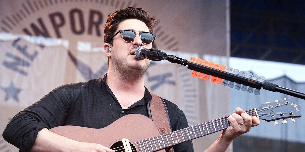 Marcus Mumford was seen wearing the iconic Ray-Ban Clubmaster 3016 W0365 Black half-rim sunglasses onstage at the Newport Folk Festival 2018