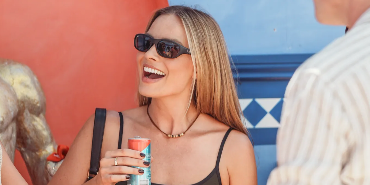 Margot Robbie was seen wearing matte black Ray-Ban Daddy-O RB 2016 W2578 sunglasses at the Glastonbury Festival 2025