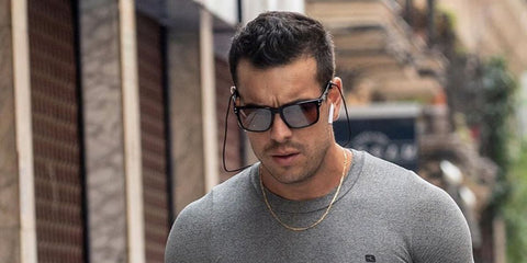 Mario Casas wears Oakley Holbrook XL OO9417 35 Prizm sunglasses while working out